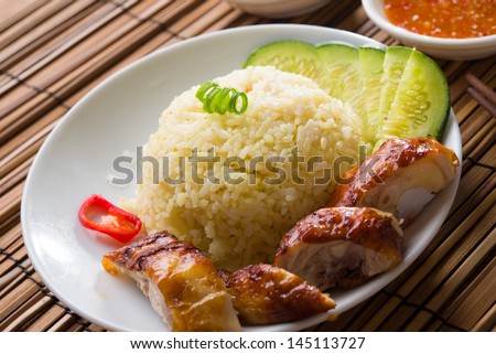 hainan chicken rice , singapore food with materials as background