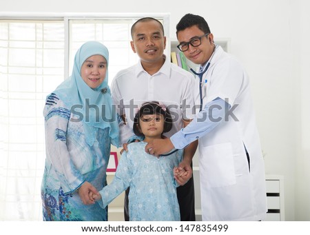 malay family visiting the doctor