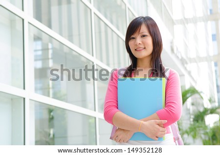 asian chinese college female student with campus background