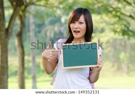 asian chinese college female student with campus background