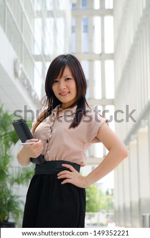 asian chinese female student in formal wear A portrait of an Asian college student on campus