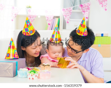 asian family celebrating baby full moon party