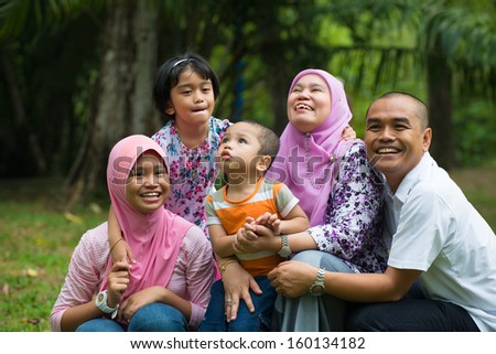 malay family having fun in the park ,malaysian people