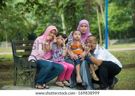 malay family having fun in the park ,malaysian people