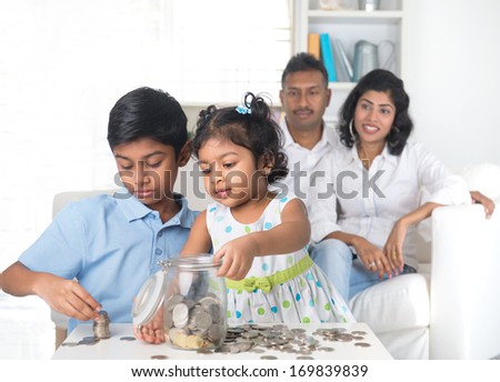 indian family teaching children on savings and financial planning