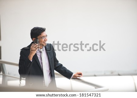 indian business man on a phone