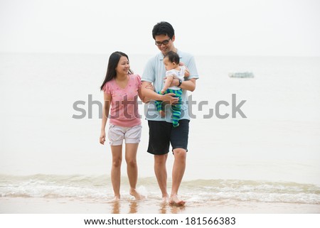 chinese asian Family walking On the Beach