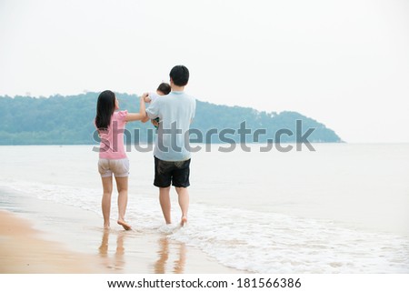 chinese asian Family walking On the Beach