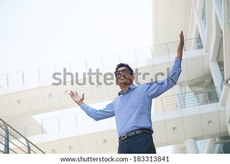 Indian businessman celebrating success at office