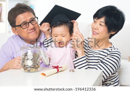 asian grand parents with grand daugther education saving concepts