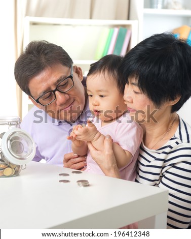 asian grand parents with grand daugther education saving concepts