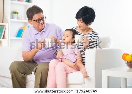 asian grand parents with grand daugther with life style background