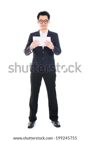 asian businessman using computer tablet full body isolated