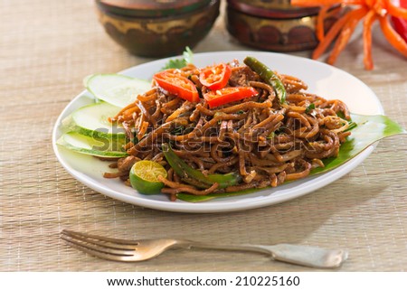 fried noodle with traditioal background