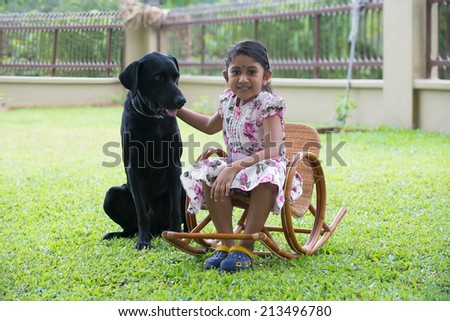 indian girl with family dog outdoor