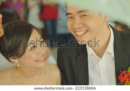 asian couple during their chinese wedding ceremony, light vintage tone
