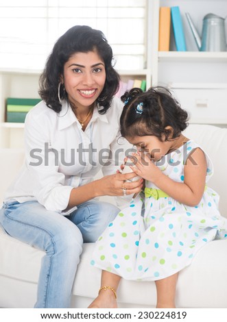 indian mother and child drinking milk