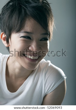 close portrait shot of smiling asian girl rock star