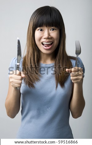 stock photo asian women on diet with fork and knife