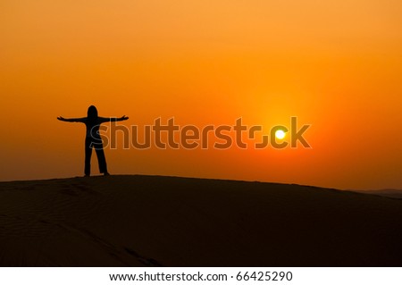silhouette of a freedom girl on thar sam sand dune desert