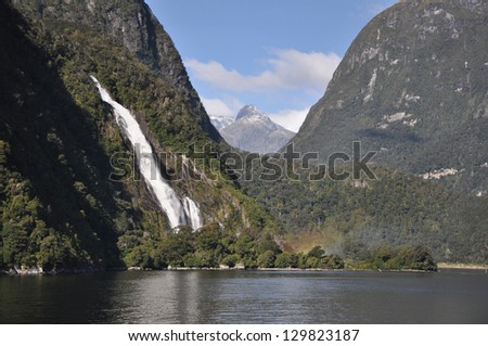Milford Sound, New Zealand - April 16th: One of the few waterfalls at Milford Sound, New Zealand on afternoon of 16 April 2010. Milford Sound is one of the famous tourist attractions in New Zealand.