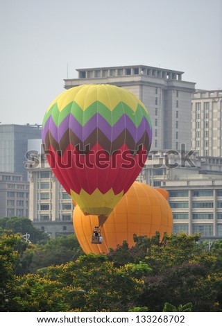 PUTRAJAYA, MALAYSIA - MARCH 29: A tethered hot air balloon floats on the air during 5th International Hot Air Balloon Fiesta at Presint 2, Putrajaya on March 29, 2013.
