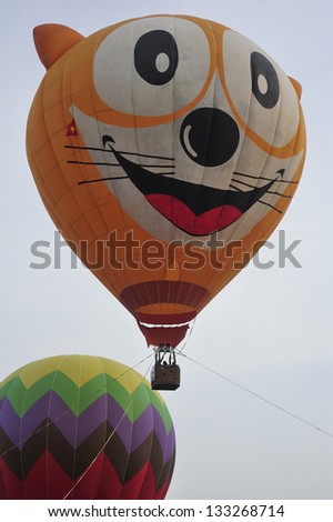 PUTRAJAYA, MALAYSIA - MARCH 29: Two tethered hot air balloons float on the air during 5th International Hot Air Balloon Fiesta at Presint 2, Putrajaya on March 29, 2013.