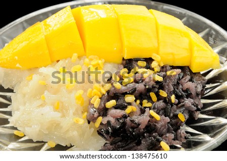 Sticky Black and White Rice Mango, Thai Dessert on Black Background