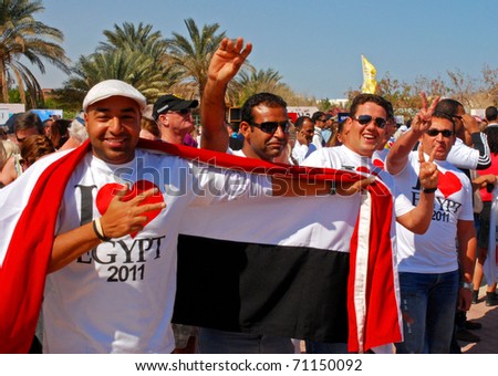 HURGHADA, EGYPT - FEBRUARY 14: Unidentified man greets the crowd at an \'I Love Egypt\' street party on February 14, 2011 in Hurghada, Egypt.
