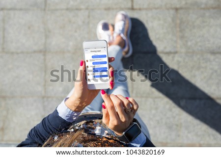 Woman using instant messaging app on mobile phone