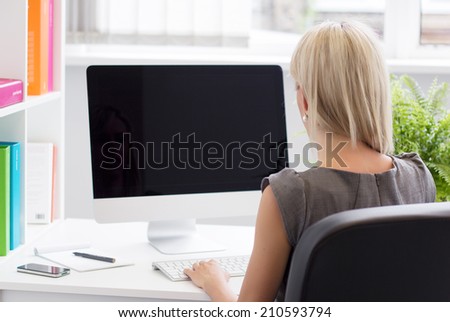 Young professional woman working in the office