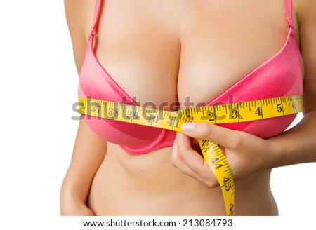 Woman with big boobs measuring her bust