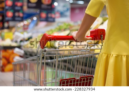 Woman shopping for groceries in supermarket
