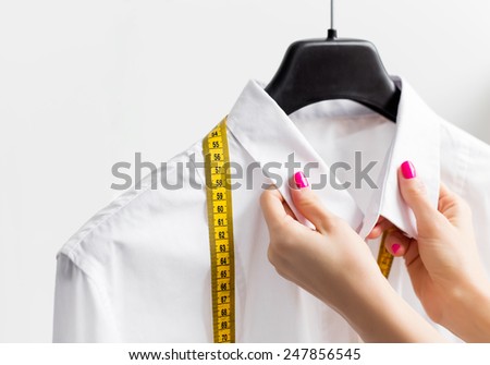 Woman tailoring business shirt
