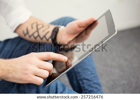Young man using tablet computer Young man using tablet computer