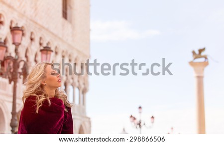 Portrait of woman in red cloak in Venice