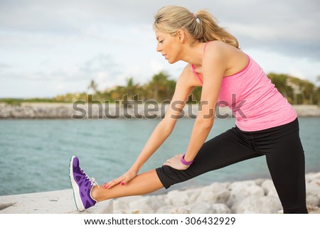Woman stretching before morning exercise