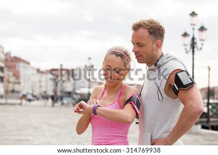 Woman using wearable technology during workout