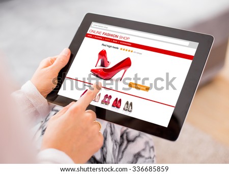 Woman using digital tablet to shop online