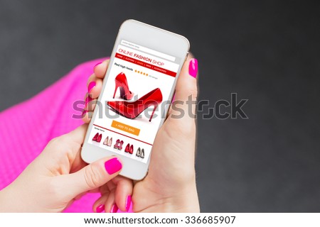 Female using smartphone to buy shoes online