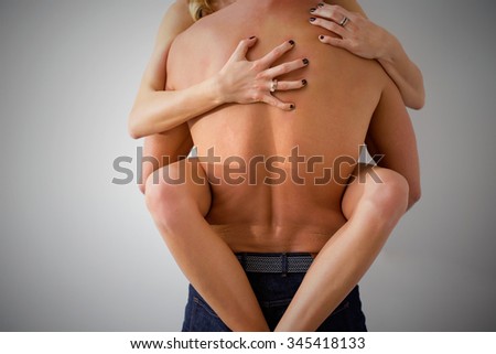Man and woman having rough sex against the wall