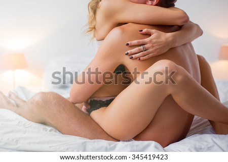 Men sitting naked on female lap