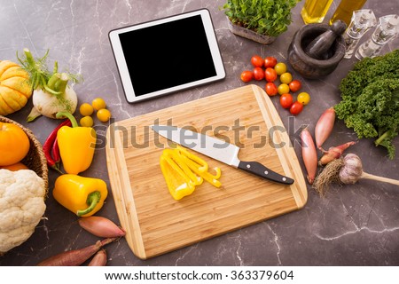 Preparation table in kitchen for cooking with tablet