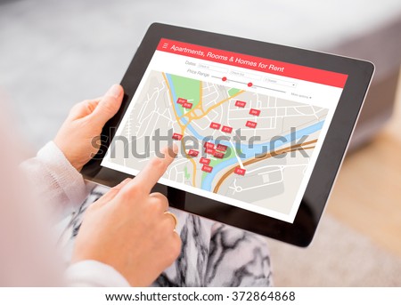 Person looking for places to stay on digital tablet app