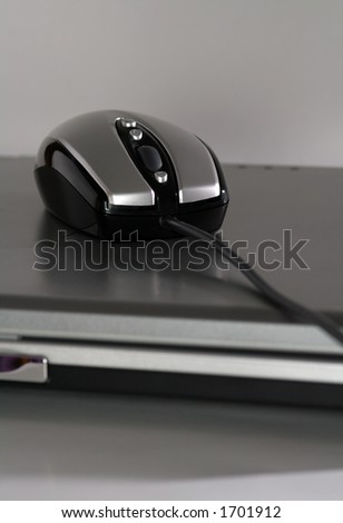 The new generation mouse that look like a racing car on a silver laptop