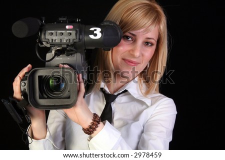 TV reporter with video camera making reportage