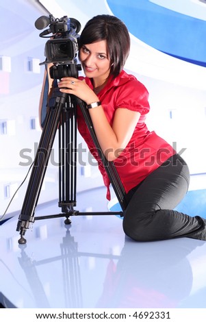 Young woman reporter posing like a photo model in TV studio