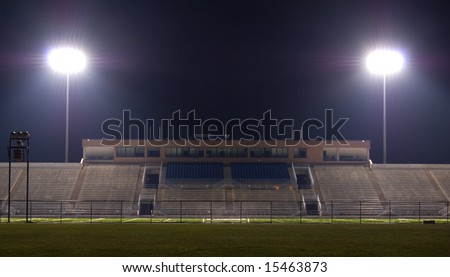 stock photo : Empty football stadium at night with the lights on