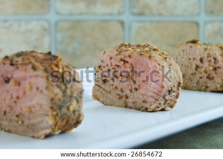 Sliced pork tenderloin with focus on center piece