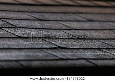 Black Shingles On A Roof In Close Up